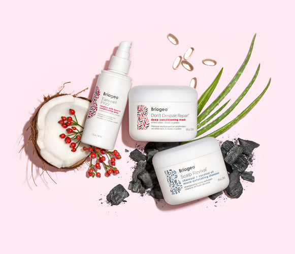 Briogeo products pictured with ingredients including coconut, aloe, and charcoal